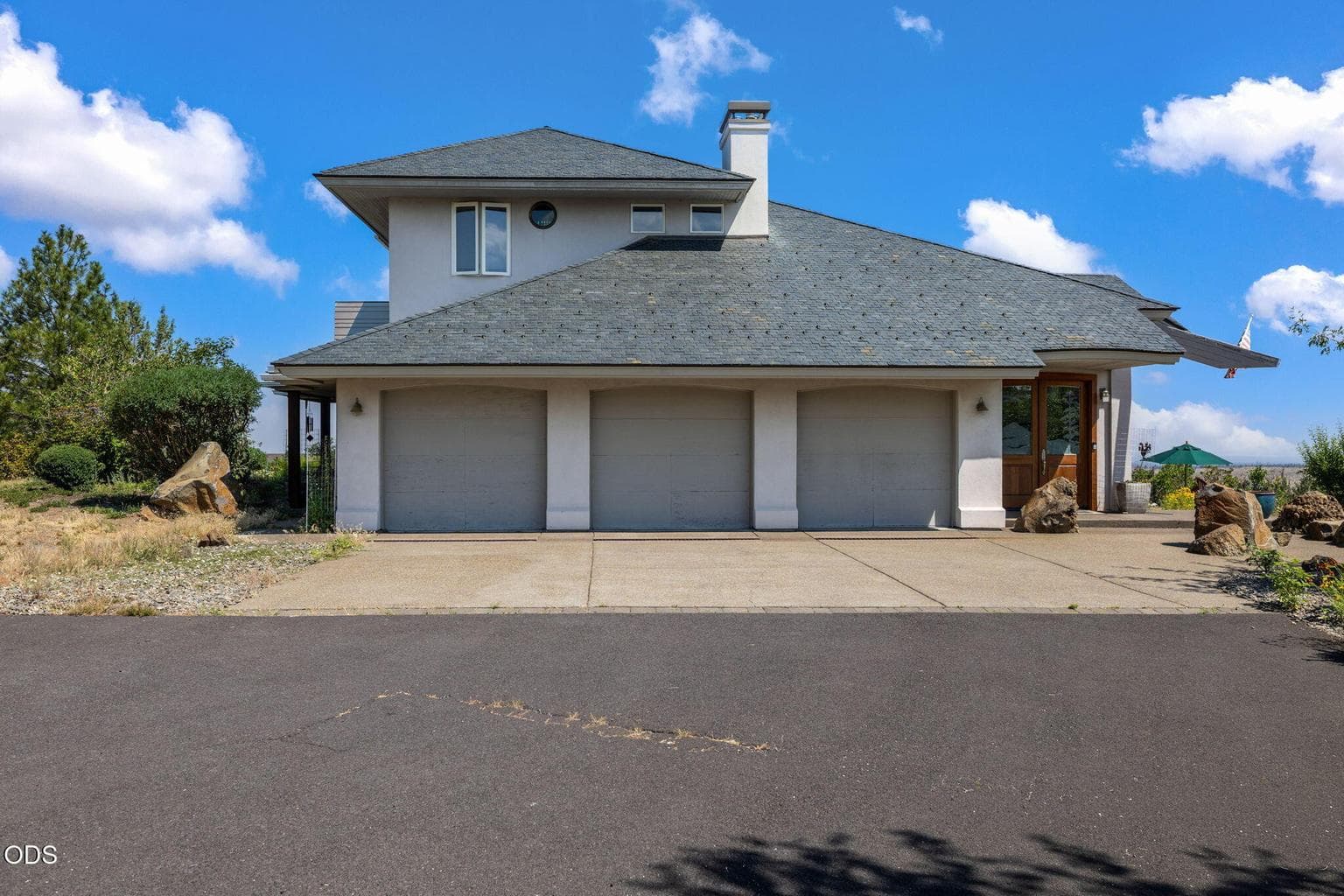 3-Car garage with spacious driveway