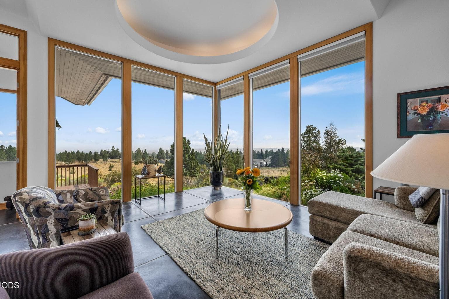 Amazing wall of windows - floor to ceiling making the Living room a perfect place to enjoy the outdoor in!
