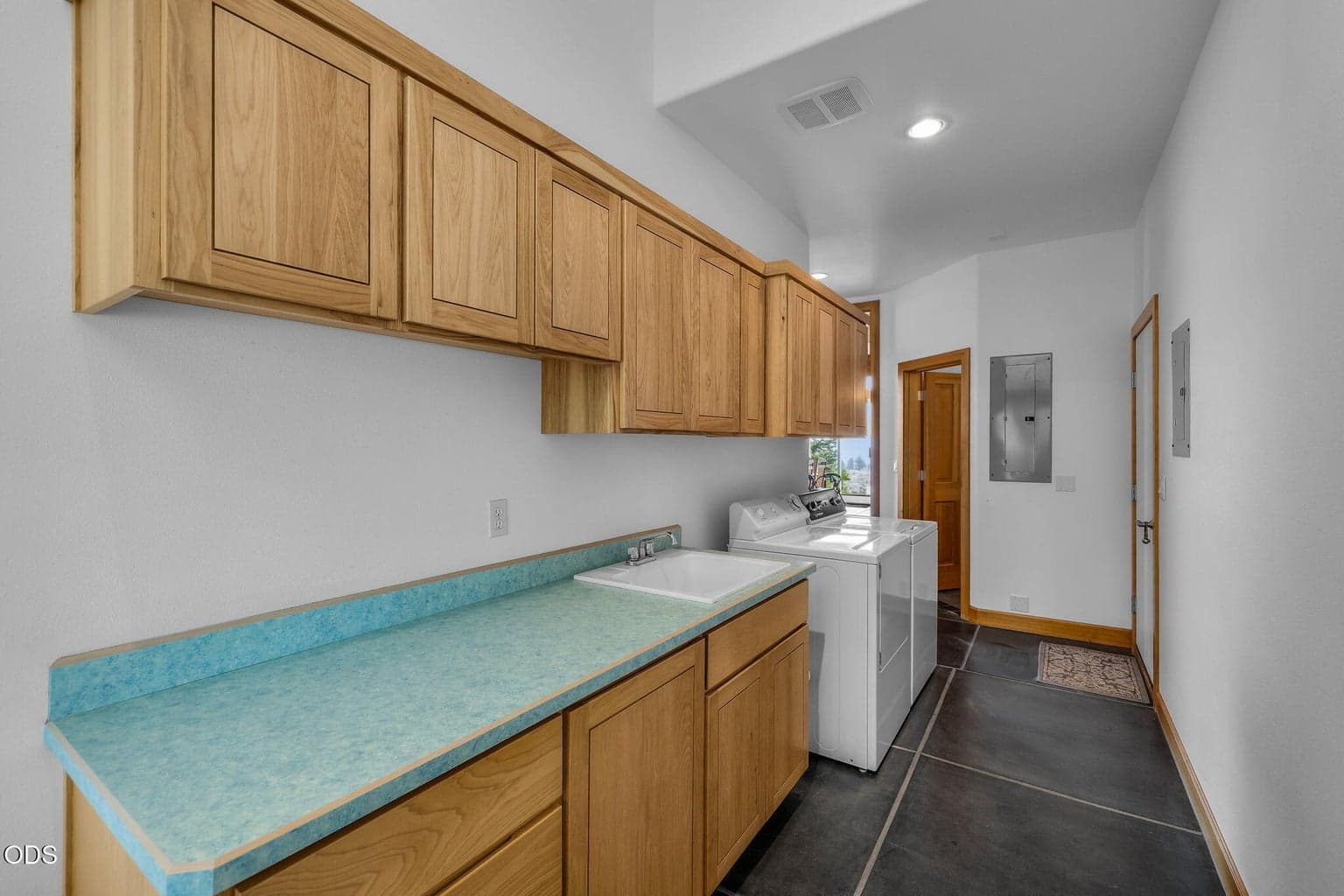 Spacious laundry room with plenty of countertop to do your laundry