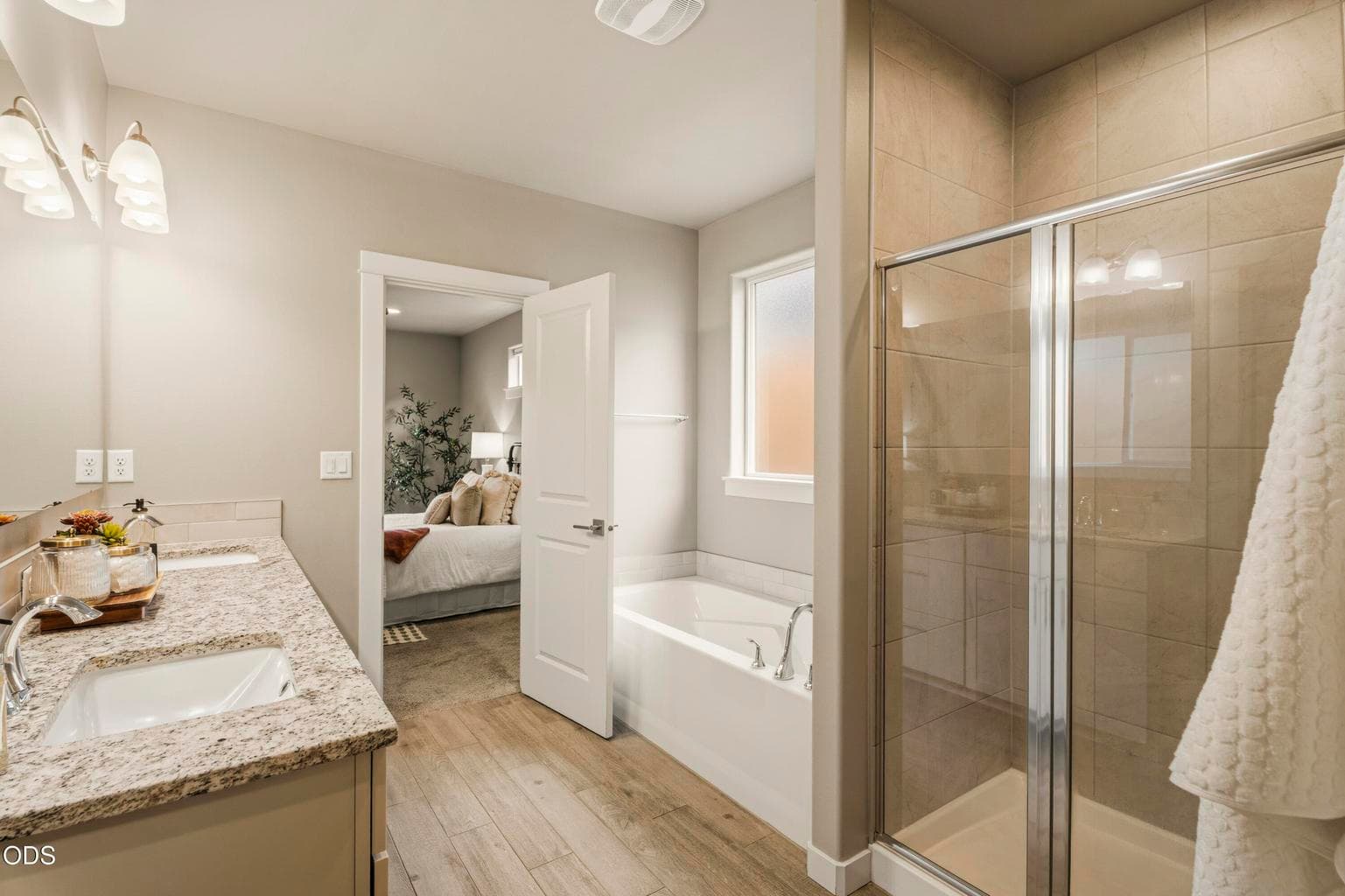 Primary bath with tiled shower and soaker tub