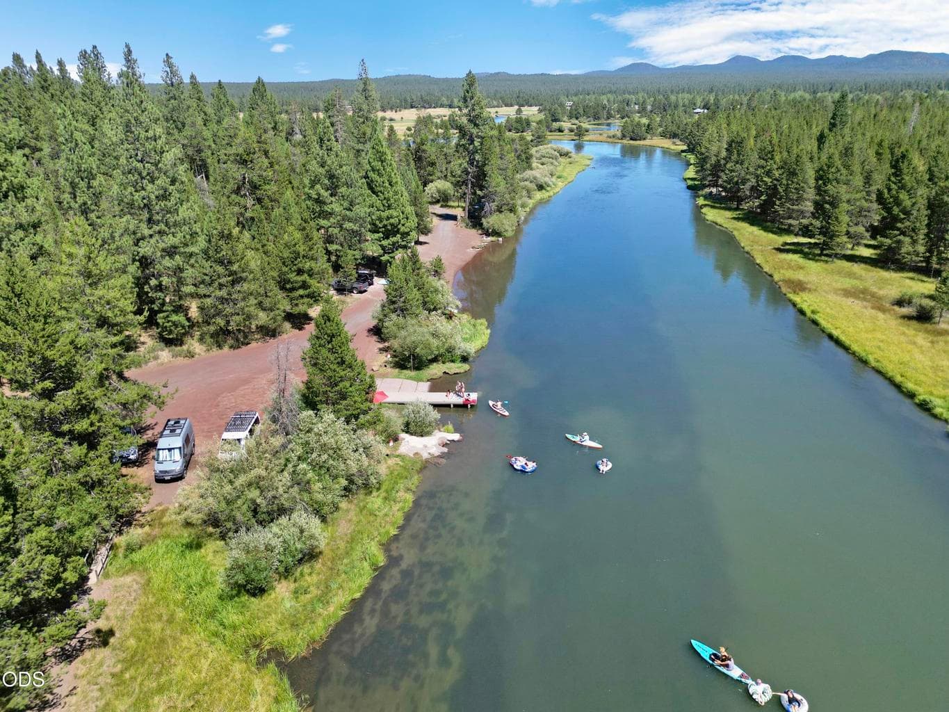 Life on the water is part of the package — residents kayak and paddleboard straight from the private community dock.