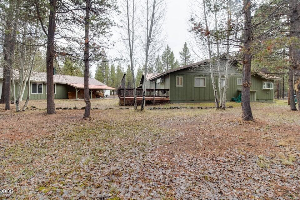 Home and Detached Garage with Attached Carport and Extra Storage Room