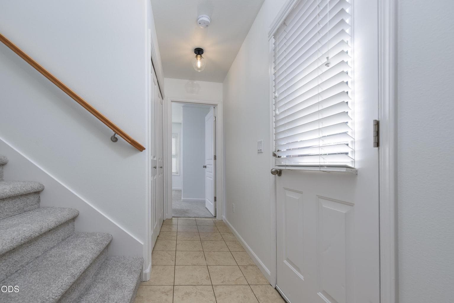 entry level hallway leading to the ensuite on that level.
