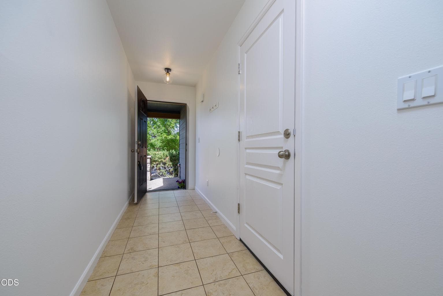 Door to the garage off the front entry hallway.