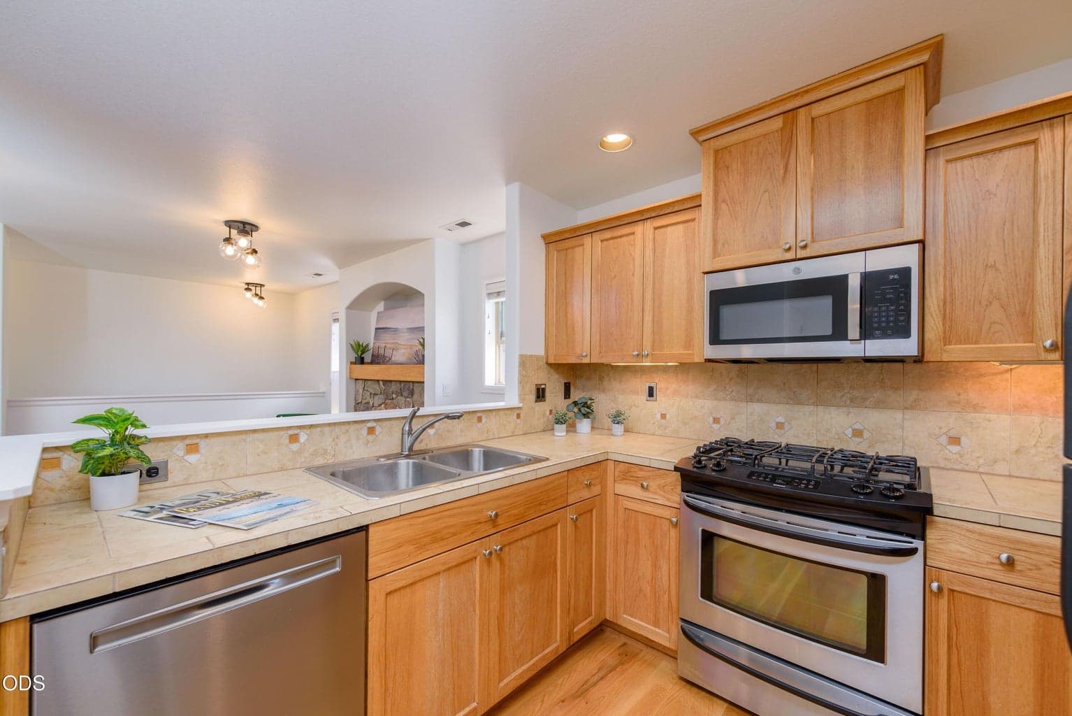 Stainless appliances and beautiful wood cabinets.