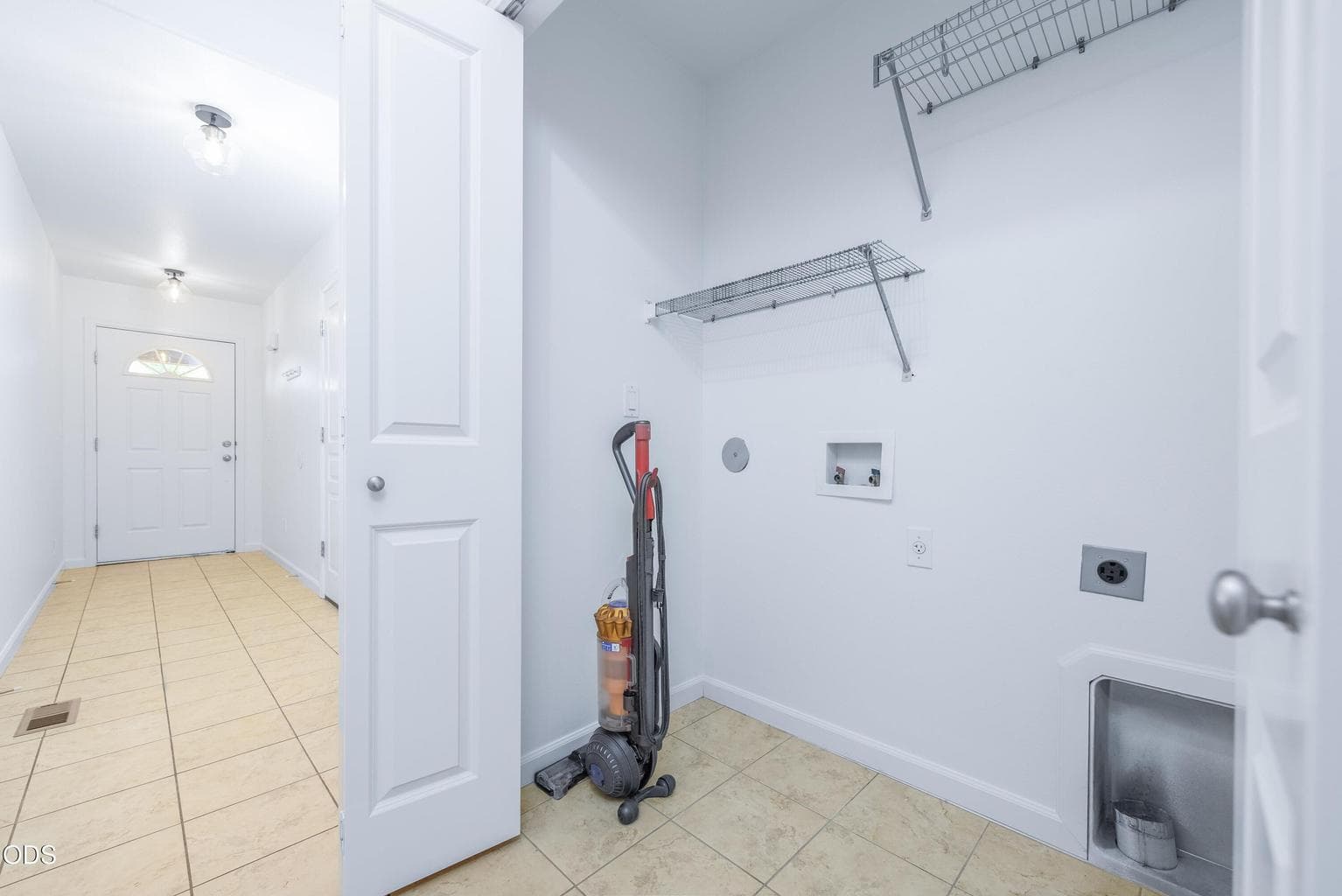 Laundry area off the entry hallway.