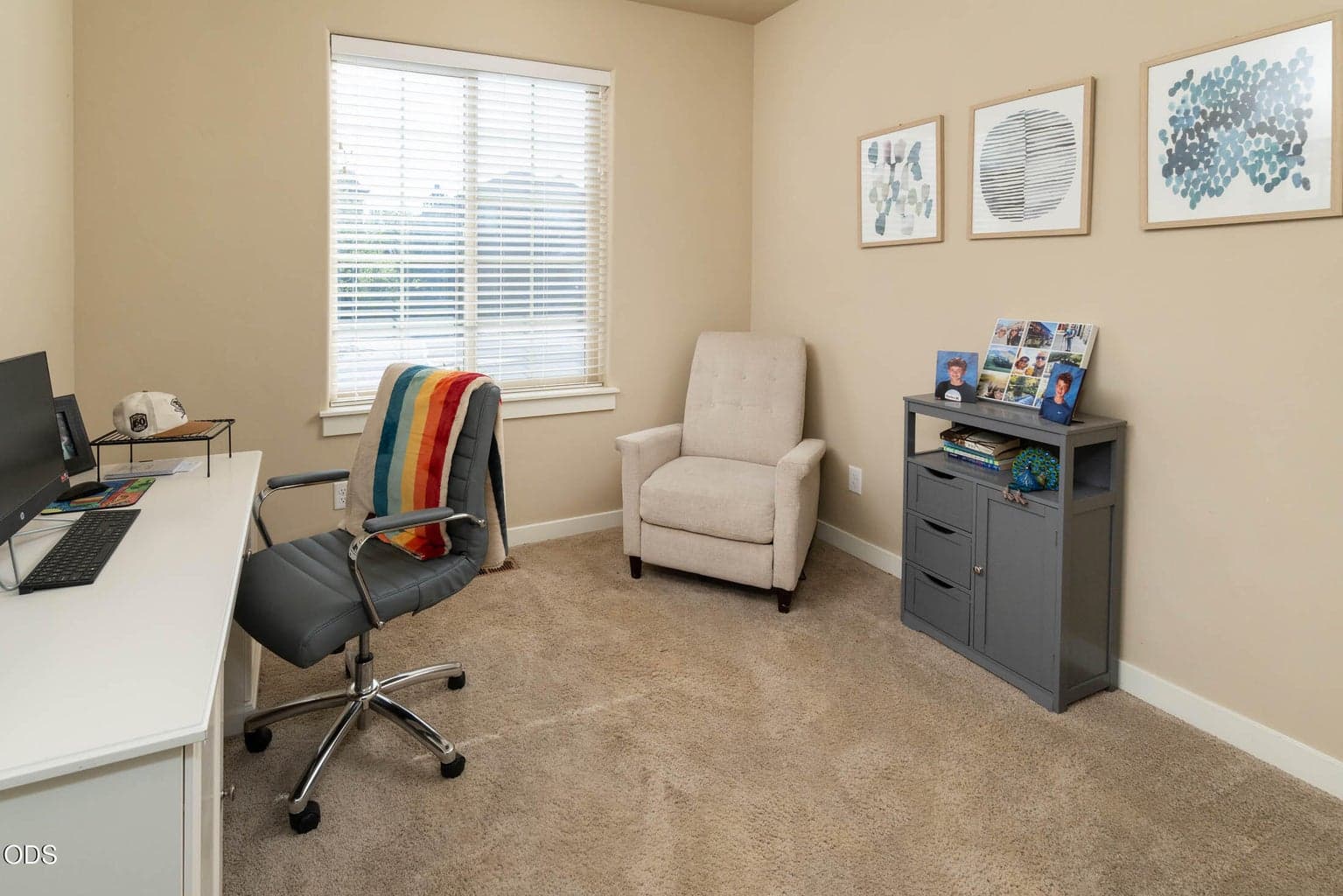 Spacious separate office is just off the front entry. Office and home have ALL new carpeting throughout, wherever there is not engineered wood flooring. The carpeting, which was installed after the photo is much brighter. Notice vacant photos showing the new carpeting.