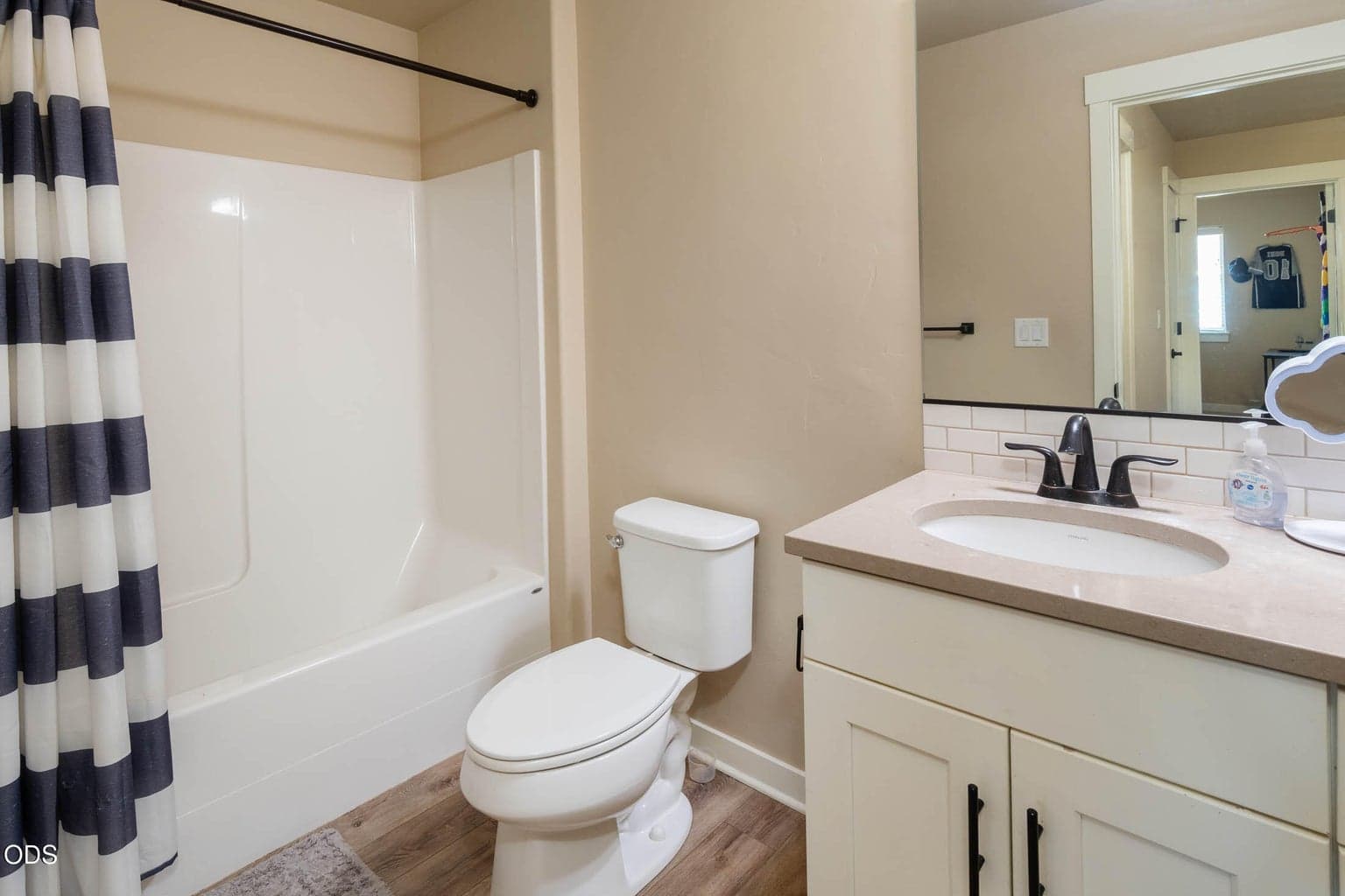 Bedrooms 2 and 3 share the main bath with full tub and shower. This includes solid-surface counter-top and quality engineered hardwood.