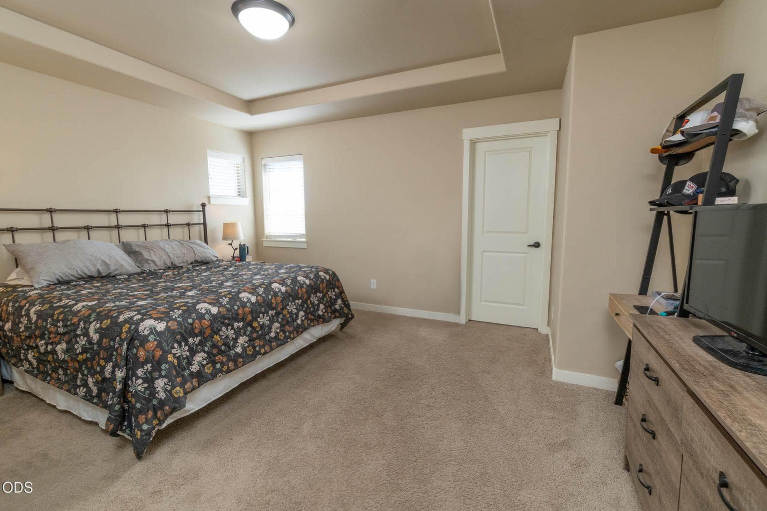 Primary bedroom suite features coved ceiling treatment, adjoining ensuite, very large walk-in closet.