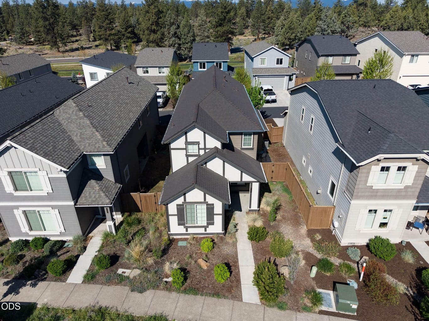 Stylish SE Bend home in lovely treed neighborhood in a convenient location with easy proximity to everyplace. The Alpenglow Park across the street has play areas with rock-climbing, trails, and plenty of space. On Thursday summer evenings you may get to enjoy music and food there. Caldera HIgh School is just steps to the South of Alpenglow Park.