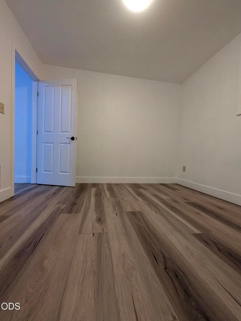 Additional bedroom with updated flooring, neutral walls, and flexible use as a bedroom, office, or hobby space.