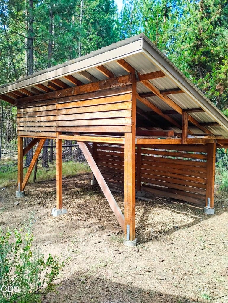 Covered lean-to storage area offering convenient space for tools, firewood, equipment, or outdoor supplies.