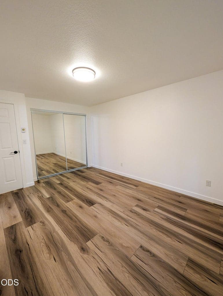 Main bedroom with updated flooring, neutral paint, and a bright, clean layout ready for personal touches.