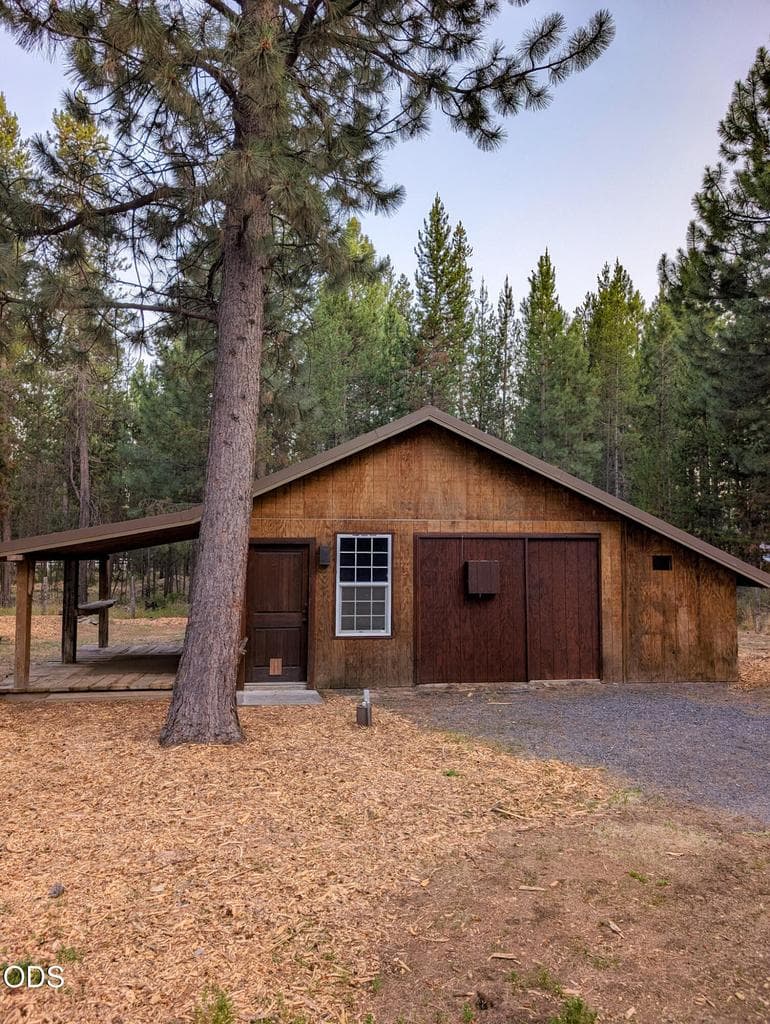 Shop exterior featuring a covered porch area, perfect for entertaining family and friends with a BBQ, while also offering a functional outdoor workspace or shaded storage area.