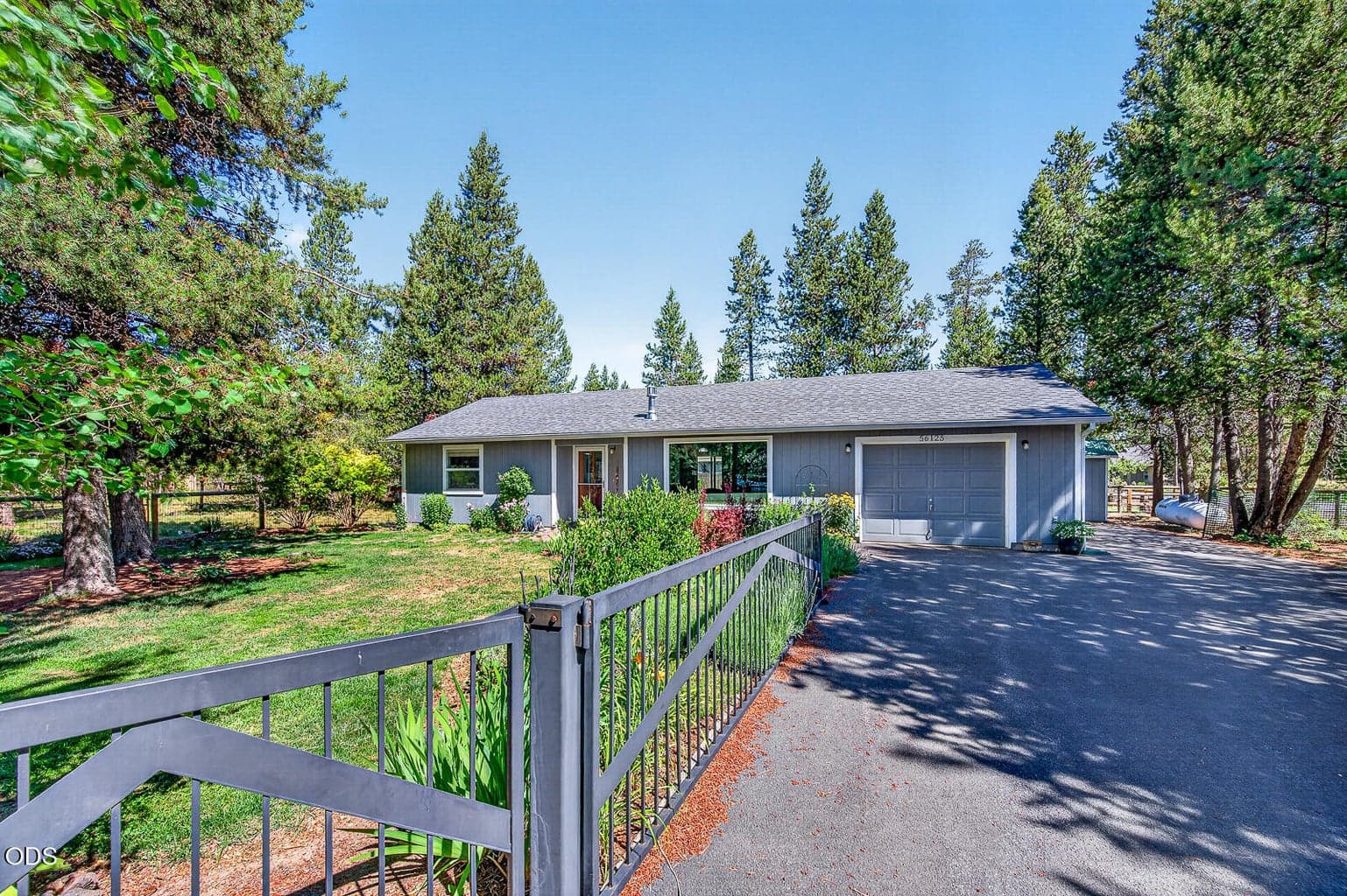 Fully paved and gated driveway with RV parking