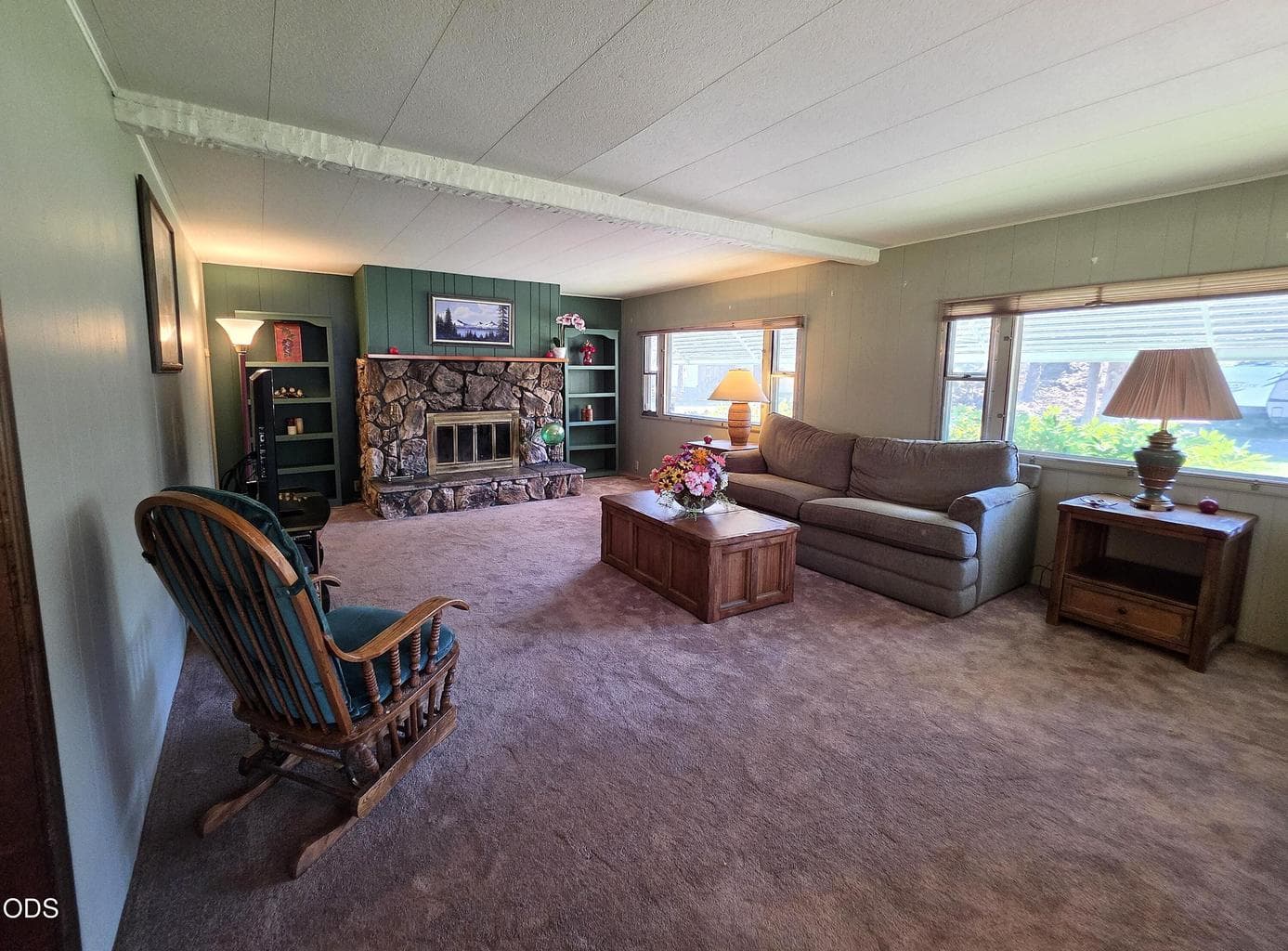 Large living room with lots of windows