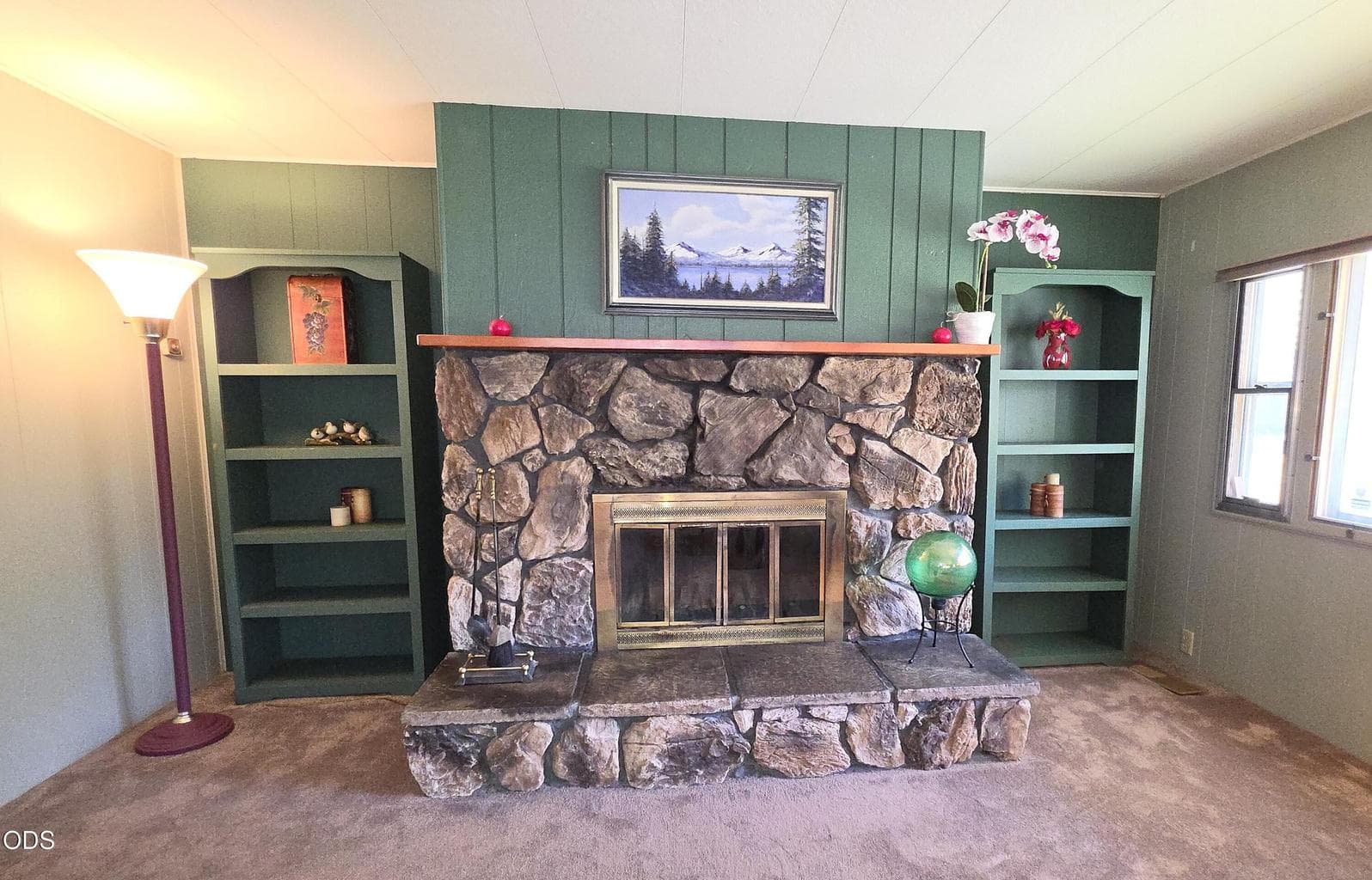 wood burning fireplace at end of living room