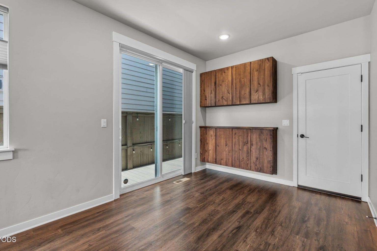 Custom built ins for added storage. Slider leads to small outdoor deck.