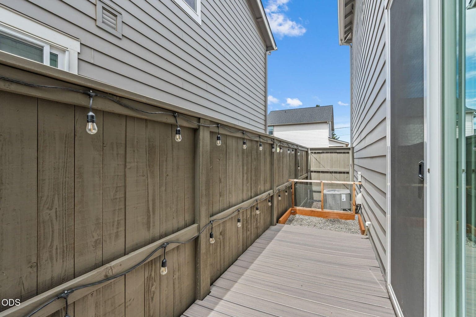 Side yard has upgraded trex deck and small dog bathroom area