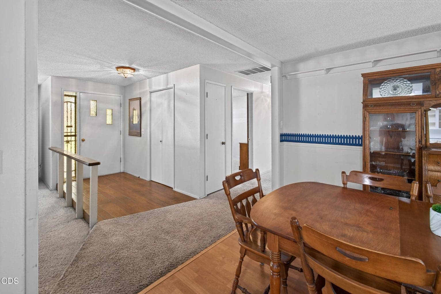 Looking from the dining room towards the hall and front door