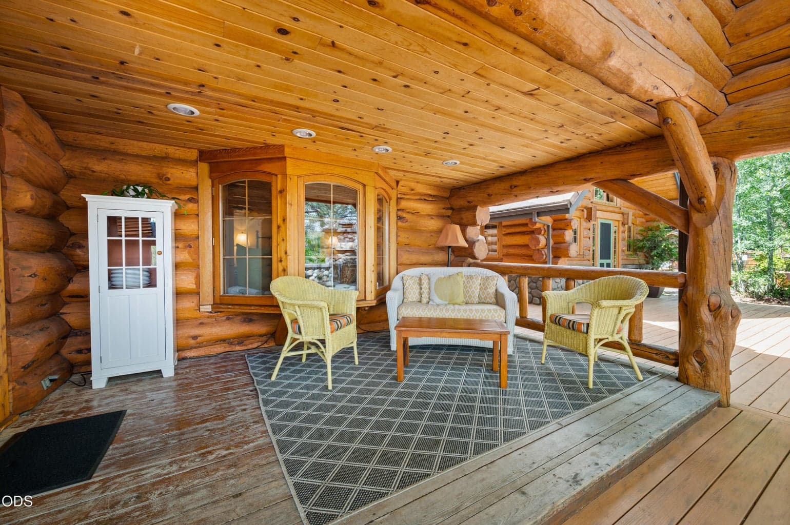 This covered back porch is one of many exterior entertainment areas.