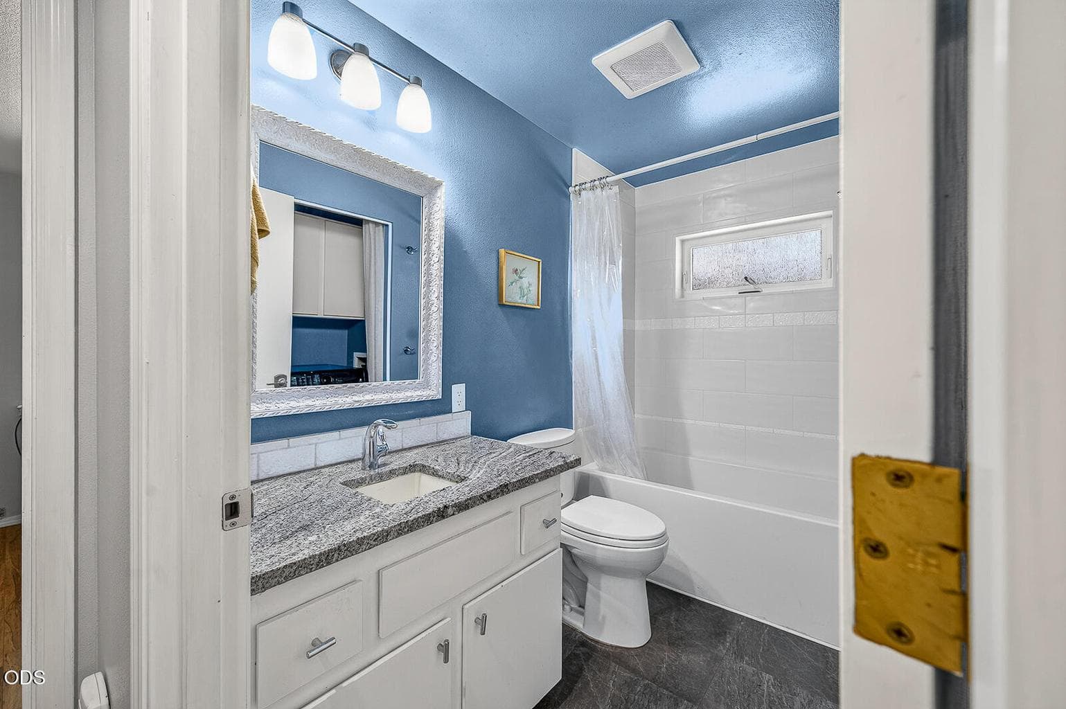 Remodeled bath including granite counter, new window, tile tub/shower, and fan