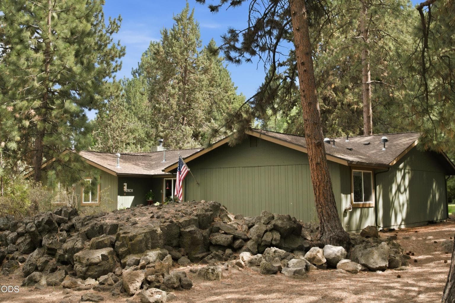 The rock outcropping between the street and home gives an extra layer of privacy