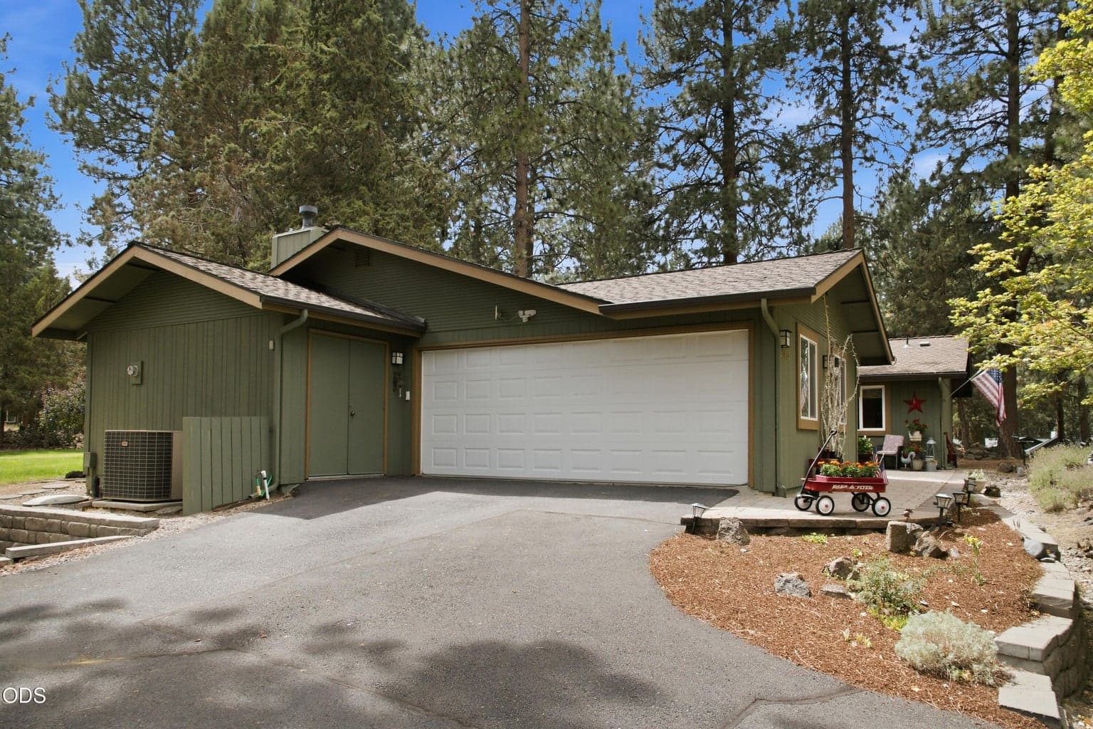 This home boasts a good-sized double garage plus a golf cart garage