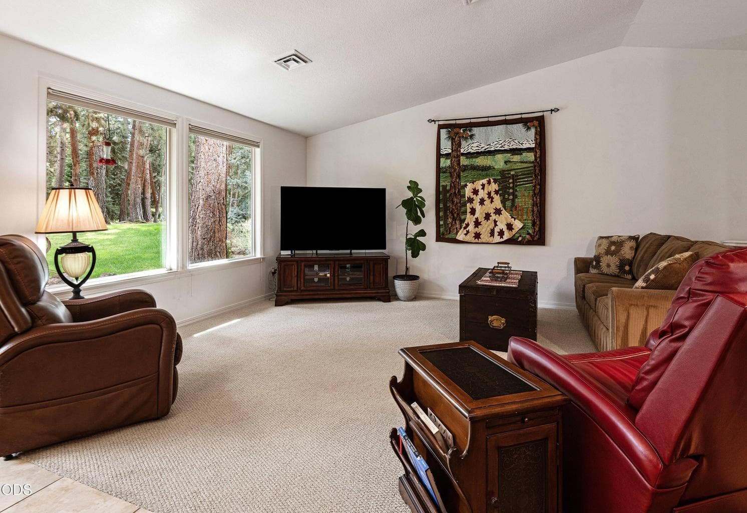 Enjoy beautiful backyard green space and nature through large windows