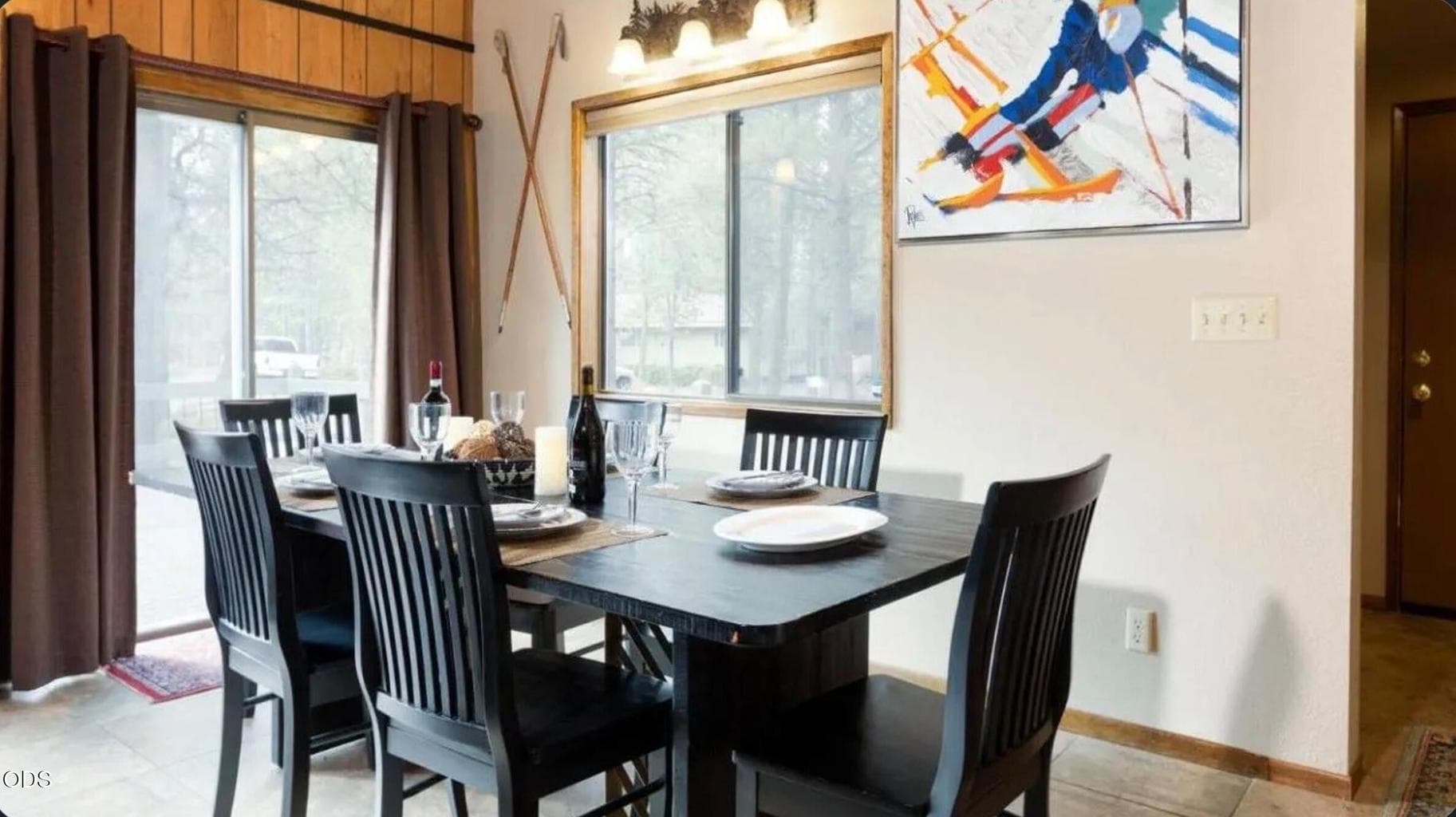 Dining area with easy access to the front deck and patio, offering a comfortable space for meals, games, and gathering after a day of Sunriver activities.