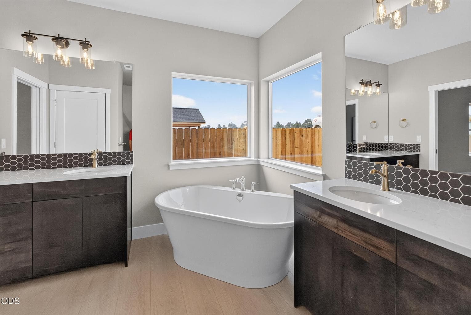 Primary bathtub & dual vanities
