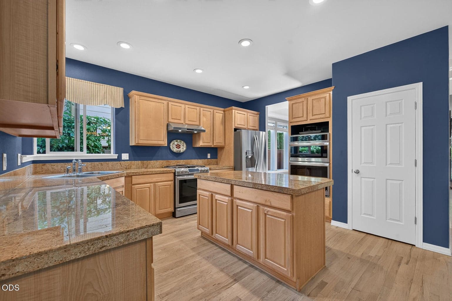 Granite counters in the spacious kitchen with pantry