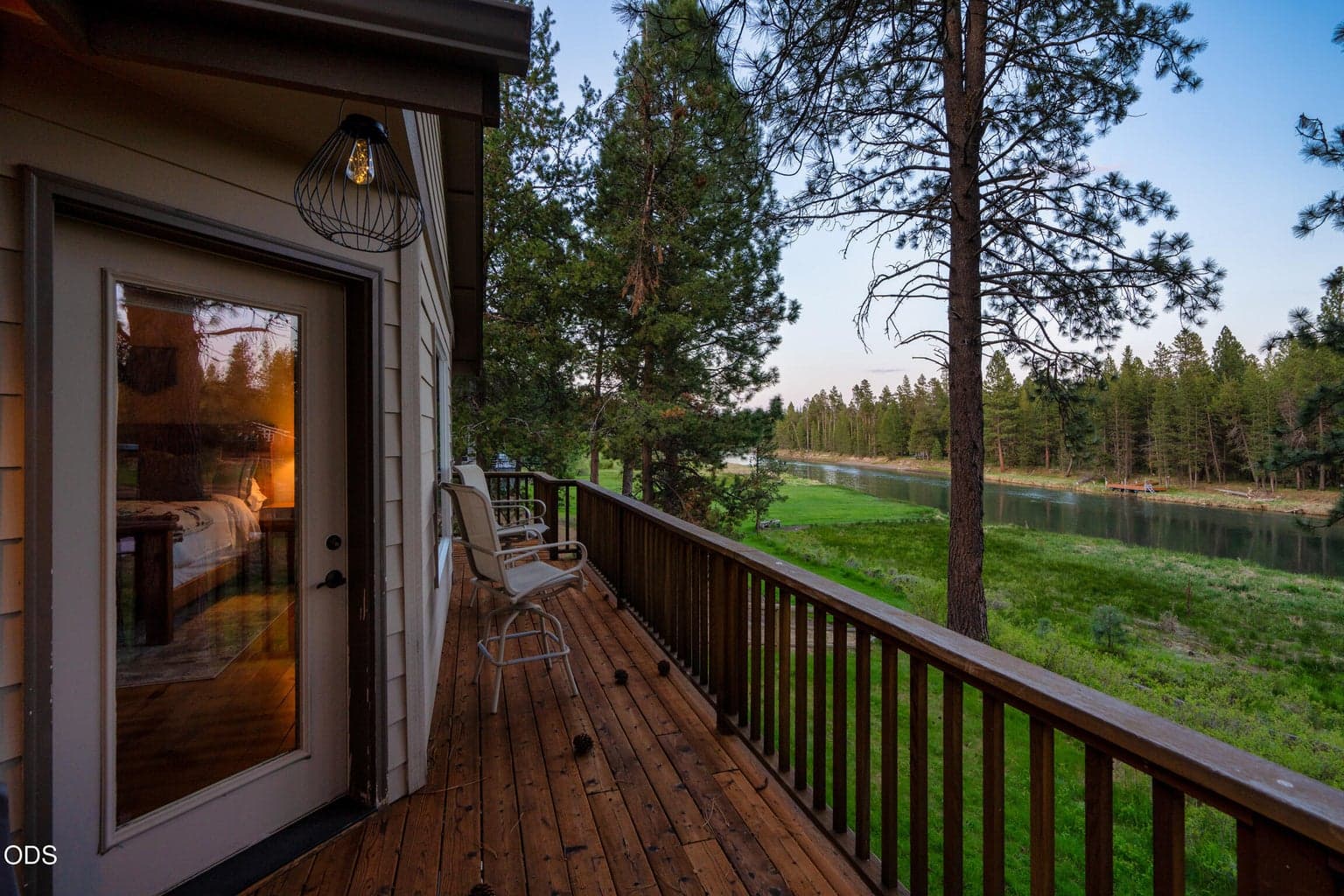 Exterior door from the Primary suite to the deck and Panoramic river views