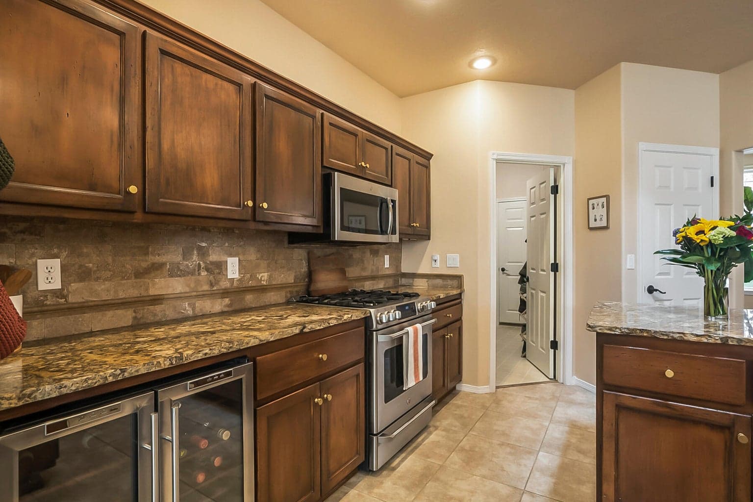 Spacious Kitchen with Island, Bar Seating, & Skylight