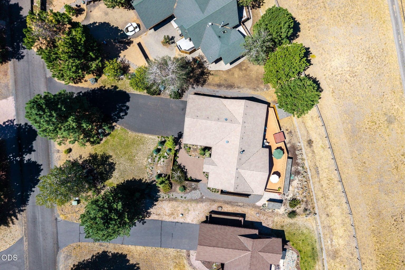 A nicely treed, landscaped and level setiing