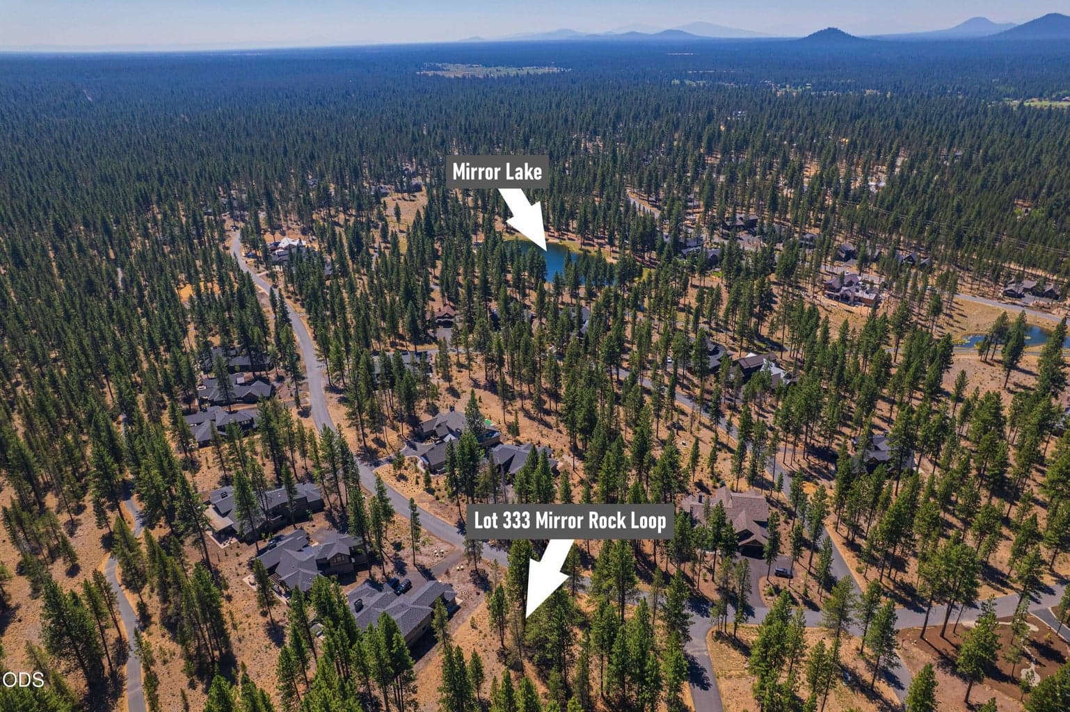 This aerial highlights Lot 333 within Caldera Springs and its proximity to picturesque Mirror Lake, connecting the homesite to the setting and lifestyle beyond.