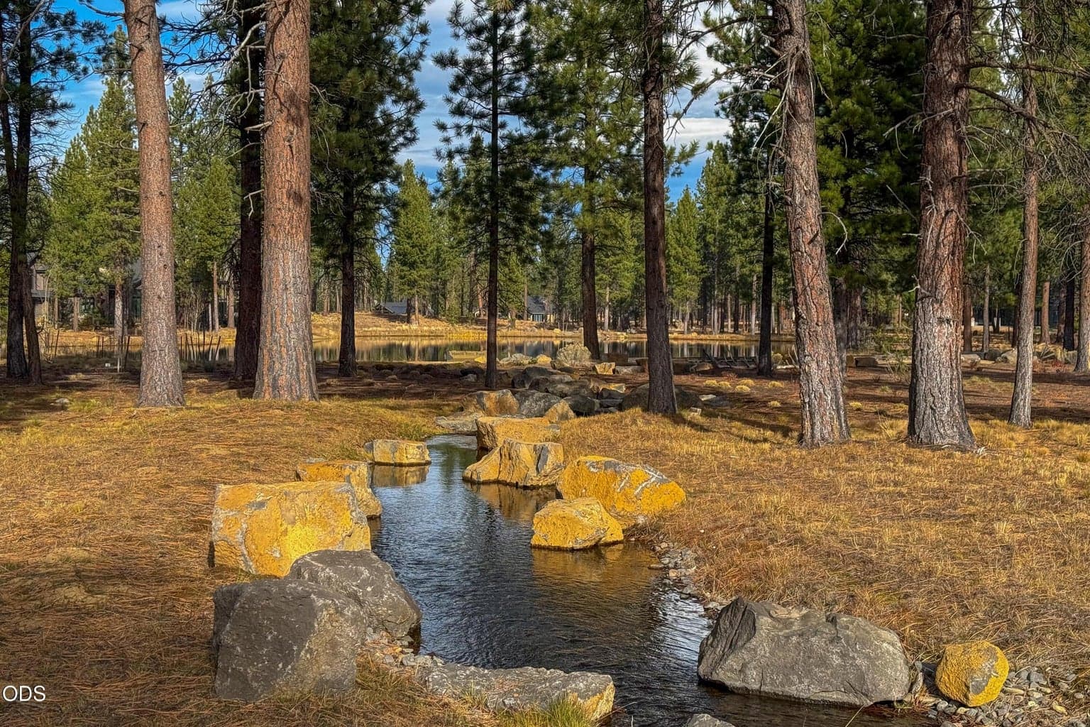 Naturalistic streams, native landscaping and soft forest scenery are integrated throughout the Mirror Rock neighborhood of Caldera Springs.