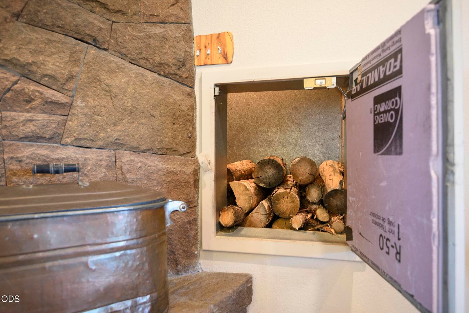 Firewood loaded from outside-accessible inside