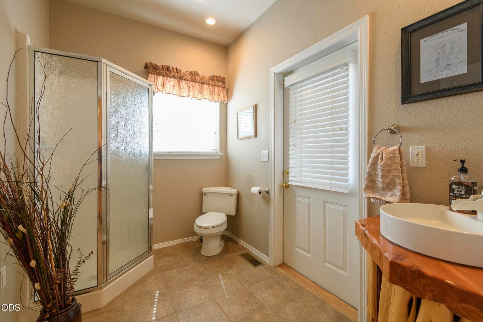 Half-bath with shower off laundry room. Door to back deck