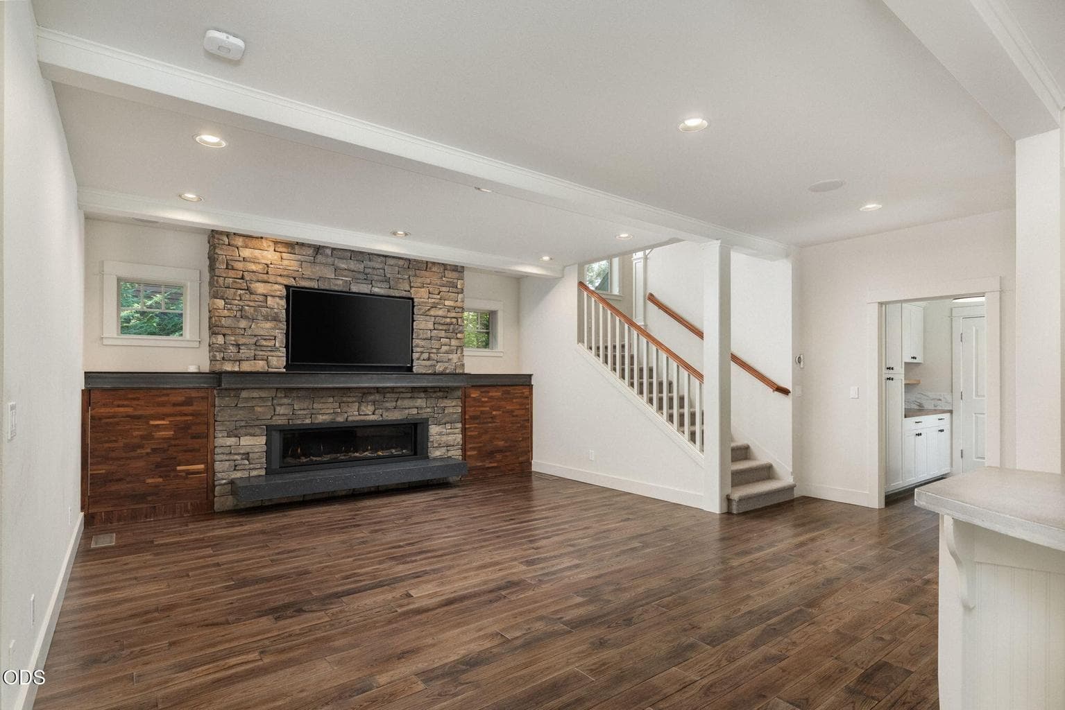 Living Room with Gas Fireplace and Cabinet Storage