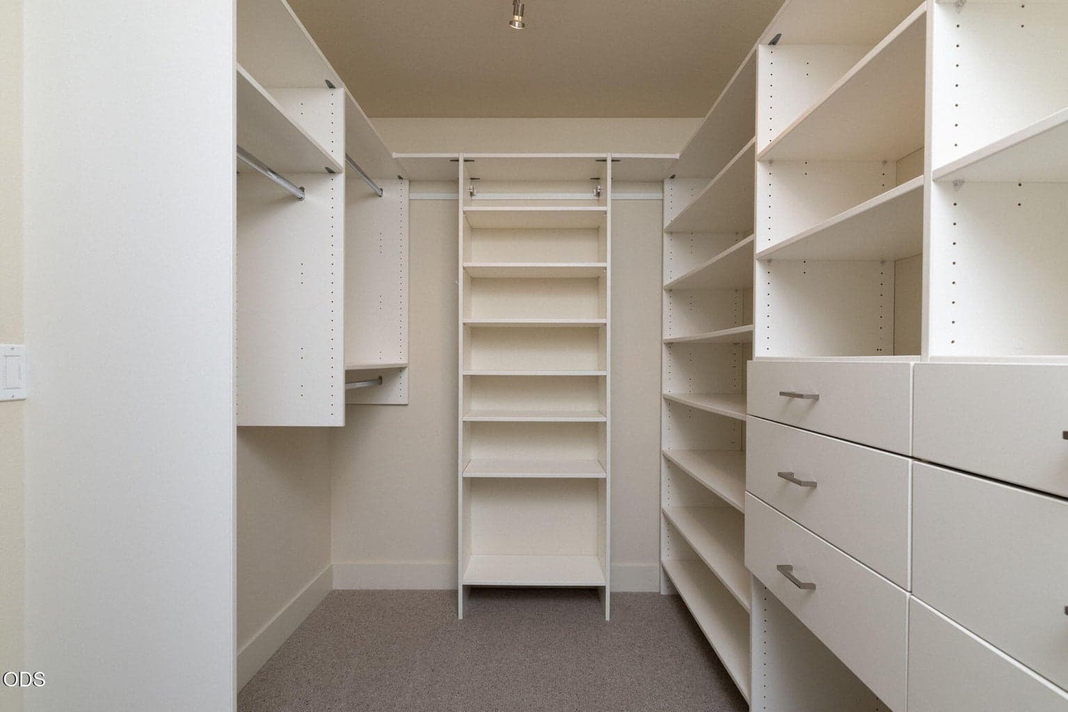 Primary Walk In Closet with Custom Built-Ins by Brian's Cabinets