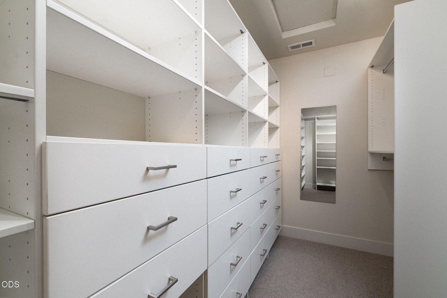 Primary Walk In Closet with Custom Built-Ins by Brian's Cabinets