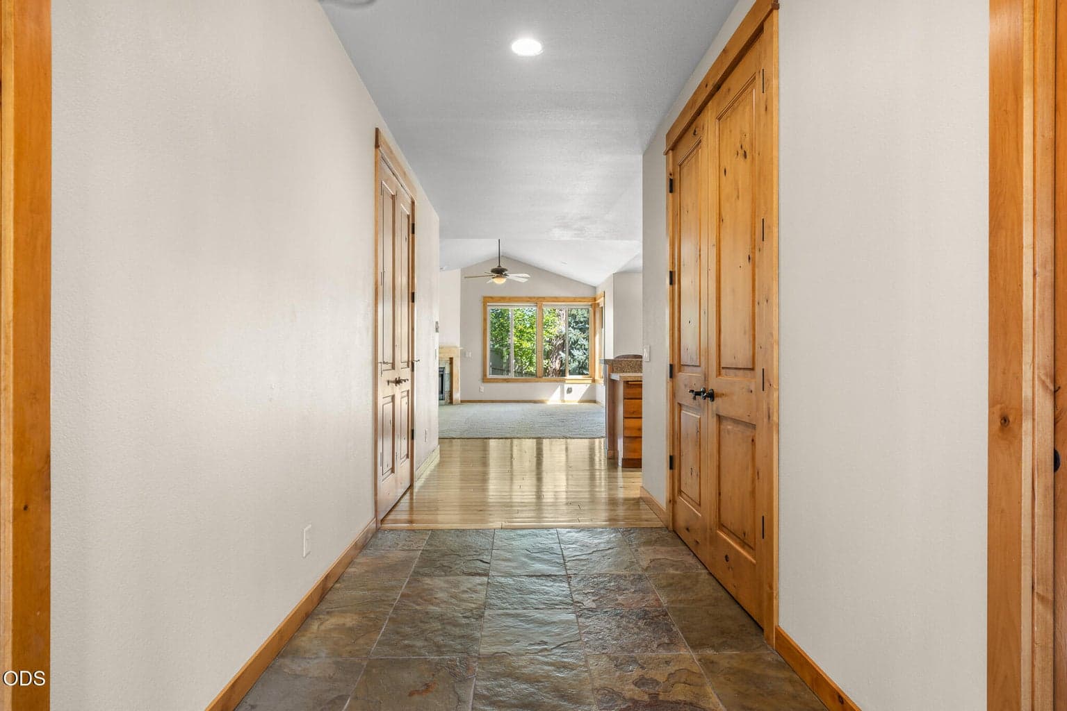 9 foot ceilings and 8 foot doors throughout, coat closet on right and pantry on the left