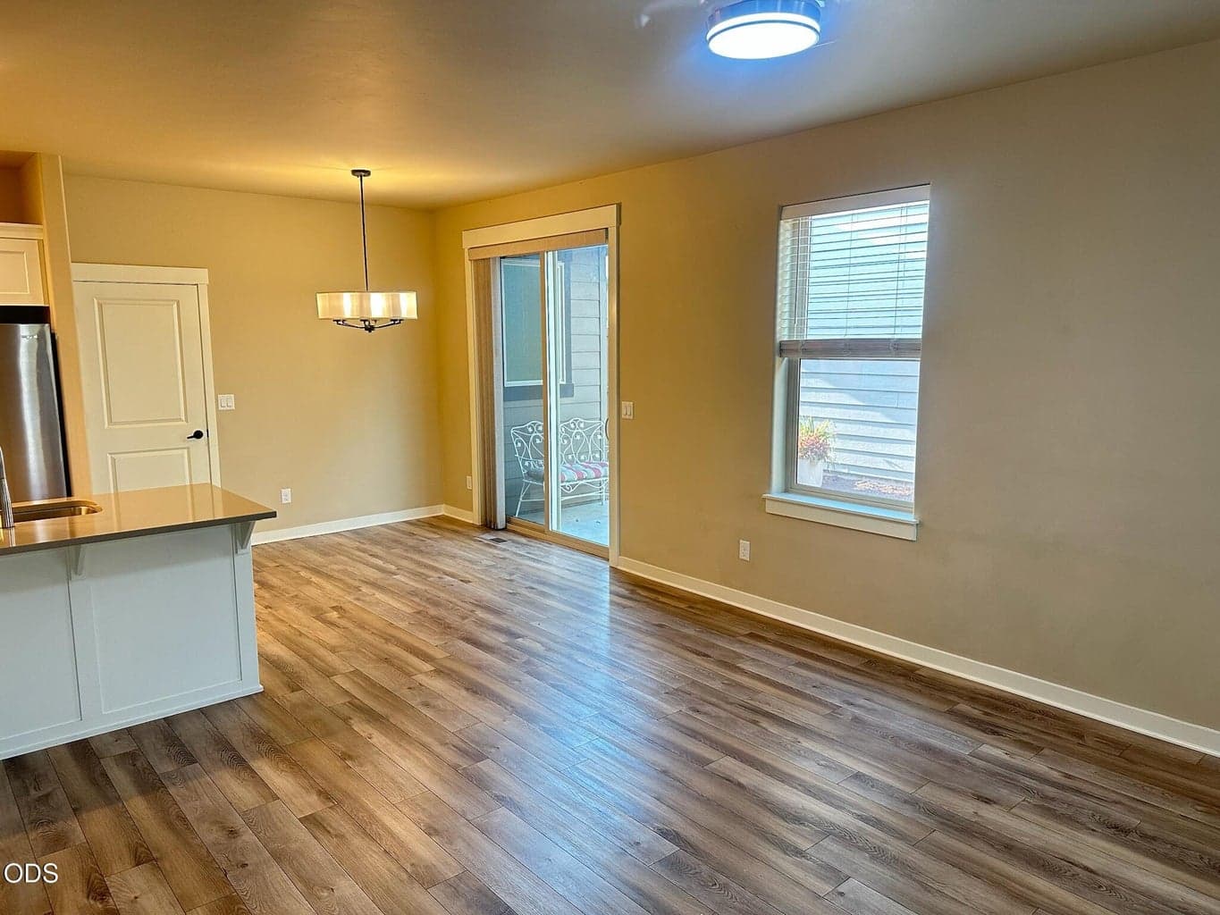 Vacant photos of this home for comparison. Some light fixtures have been updated in the home, plus brand new carpet and pad in all the carpeted rooms!