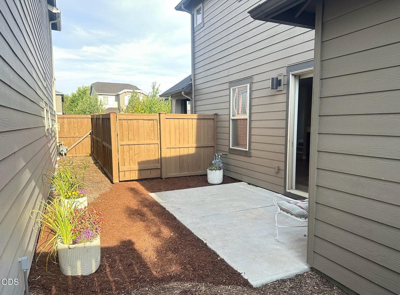 Private patio area is fenced and gated. Great spot to entertain guests or just relax. Enter from the home, front or back yards.