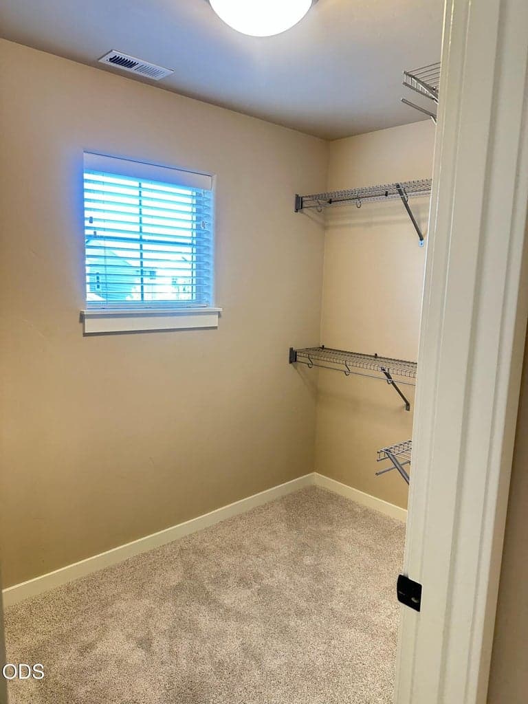 The walk-in closet adjoining the primary bedroom is very large with custom double hanging. There is a window in this closet for natural light. What a dream!