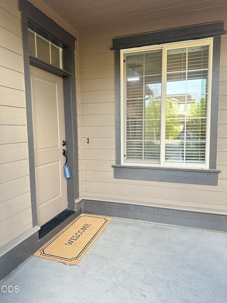 Covered entry has room for a bench and decorator items.