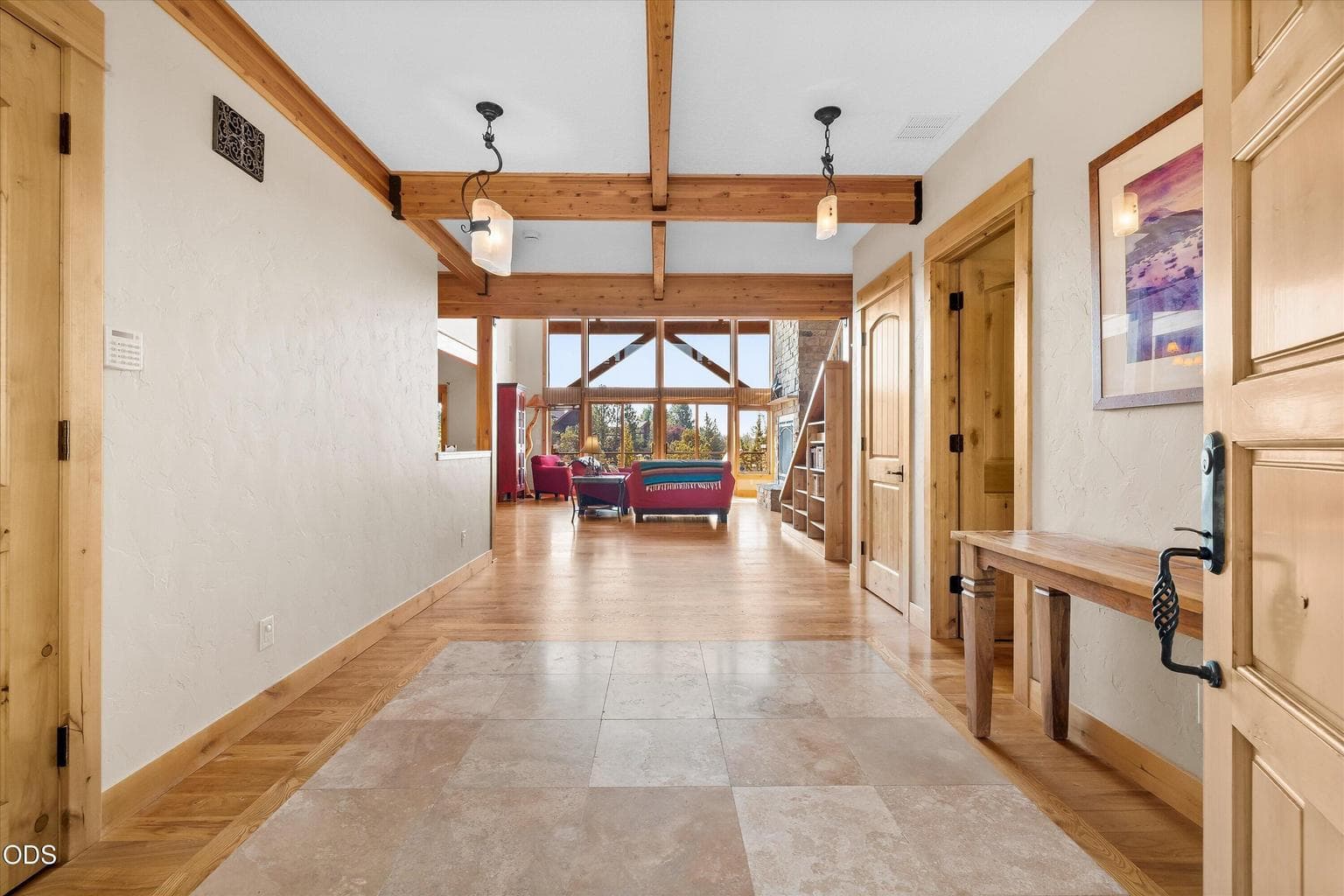 Grand foyer leads to second primary on ground floor, great room, and kitchen