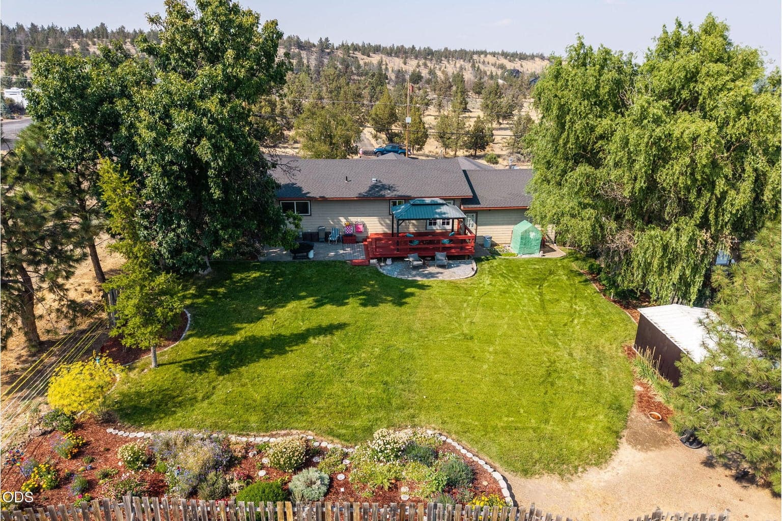 This home sits on over one-third of an acre with mature trees and a huge backyard.