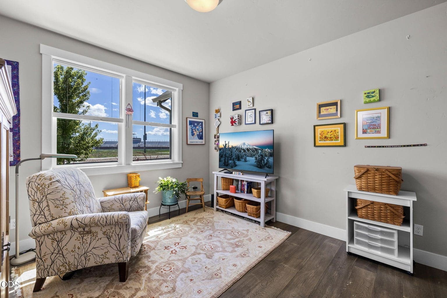 3rd bedroom/office with closet and hardwood floors